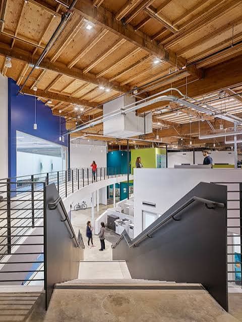 Central stair and exposed building systems in a technology office